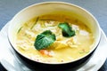Spicy coconut milk cream soup curry with chiken, tiger prawns, long soy noodles, bean sprouts, lime, chilli pepper and