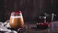 Spicy coffee latte with chili pepper in a glass on the table web banner Royalty Free Stock Photo