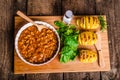Spicy cowboy beans with hassleback potatoe with herbs Royalty Free Stock Photo
