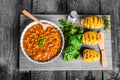 Spicy cowboy beans with hassleback potatoe with herbs Royalty Free Stock Photo