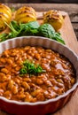 Spicy cowboy beans with hassleback potatoe with herbs Royalty Free Stock Photo