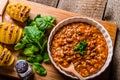 Spicy cowboy beans with hassleback potatoe with herbs Royalty Free Stock Photo