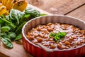 Spicy cowboy beans with hassleback potatoe with herbs Royalty Free Stock Photo