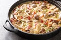 Spicy creamy mushroom and bacon gravy on dark stone background. Horizontal