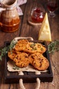 Spicy crispy cookies with cheese, sun dried tomatoes and thyme