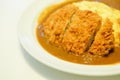 Spicy crispy pork cutlet omelet curry serve on white dish.