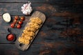 Spicy deep fried breaded chicken wings on dark wooden background, flat lay, with space for text Royalty Free Stock Photo