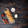 Spicy deep fried breaded chicken wings on dark wooden background, flat lay, with space for text Royalty Free Stock Photo