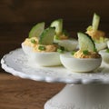 Spicy deviled eggs garnished with cucumber and leek od Royalty Free Stock Photo