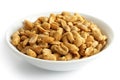 Spicy dry roasted peanuts in white bowl. Royalty Free Stock Photo