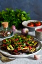 Spicy eggplant with tomato sauce and cilantro.