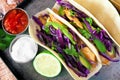 Spicy fish tacos with red cabbage slaw, overhead view