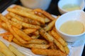 Spicy french fries in white bowl