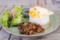 Spicy fried pork with basil leaves, stir fried basil, the famous traditional Thai food served with jasmine rice and fried egg Royalty Free Stock Photo