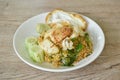 spicy fried rice seafood shrimp and squid in tom yum sauce on plate