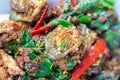 Spicy Frog with basil leaves