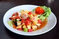 Spicy fruit salad with prawns in thai style - som tum Royalty Free Stock Photo