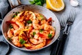 Spicy garlic chilli Shrimps on frying pan with lemon and cilantro Royalty Free Stock Photo