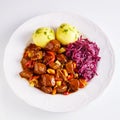 Spicy german beef platter with potato dumplings Royalty Free Stock Photo