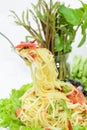 Spicy green papaya salad or Somtum on white background, Thai foo Royalty Free Stock Photo
