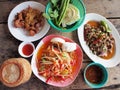 Spicy green papaya salad, spicy duck salad, fried pork