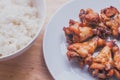 Spicy grilled chicken wings black pepper with thai rice Royalty Free Stock Photo