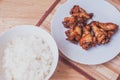 Spicy grilled chicken wings black pepper with thai rice Royalty Free Stock Photo