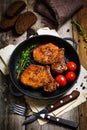 Spicy grilled pork chops in skillet Royalty Free Stock Photo