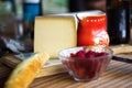 Cheese, bread, raspberry and red jug. Royalty Free Stock Photo