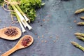 Spicy herbs, asparagus, lemons, seasonings, lentils on the kitchen table