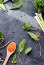 Spicy herbs, asparagus, lemons, seasonings, lentils on the kitchen table