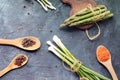 Spicy herbs, asparagus, lemons, seasonings, lentils on the kitchen table