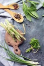 Spicy herbs, asparagus, seasonings, lentils on the kitchen table for preparing healthy homemade food