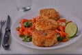 Homemade crispy fishcakes with salad.