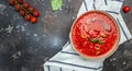 Spicy Homemade Gazpacho Soup. Summer cold vegan food on a dark background. Long banner format. top view