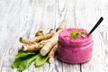 Spicy horseradish sauce in small glass jar on wooden table Royalty Free Stock Photo