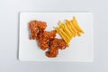 Spicy hot buffalo wings and french fries with white sauce Royalty Free Stock Photo