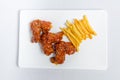 Spicy hot buffalo wings and french fries with white sauce Royalty Free Stock Photo