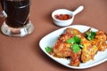 Spicy hot chicken wings cooked with honey and soy, topped with sesame seeds, served with sauce, celery and carrot sticks Royalty Free Stock Photo