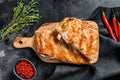 Spicy hot grilled pork spare ribs from BBQ served on cutting board. Black background. Top view Royalty Free Stock Photo