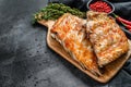 Spicy hot grilled pork spare ribs from BBQ served on cutting board. Black background. Top view. Copy space Royalty Free Stock Photo