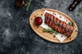 Spicy hot grilled spare ribs BBQ served on wooden cutting board, banner, menu, recipe place for text, top view Royalty Free Stock Photo