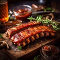 Spicy hot grilled spare ribs from a summer BBQ served with a hot chili pepper and fresh tomatoes on an old vintage Royalty Free Stock Photo
