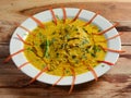 Spicy hot Kerala masala fish curry prepared using coconut milk and spices, Pomfret fish in South India style served on a ceramic Royalty Free Stock Photo