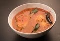 Spicy and hot king fish curry with green curry leaf Royalty Free Stock Photo