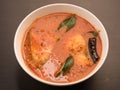 Spicy and hot king fish curry with green curry leaf Royalty Free Stock Photo