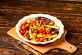 Spicy hot vegetables, cooked on an grill in ceramic bowl on wood Royalty Free Stock Photo