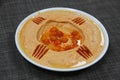 Spicy Hummus served in a dish isolated on wooden table background side view of appetizer Royalty Free Stock Photo