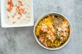 Spicy Indian biryani pulao in golden bowl with India basmati rice dish with chicken meat curry Royalty Free Stock Photo