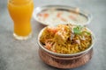 Spicy Indian biryani pulao in golden bowl with India basmati rice dish with chicken meat curry Royalty Free Stock Photo